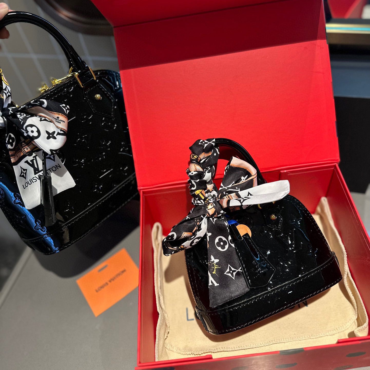 Embossed bright leather Alma shell bag 1824041702