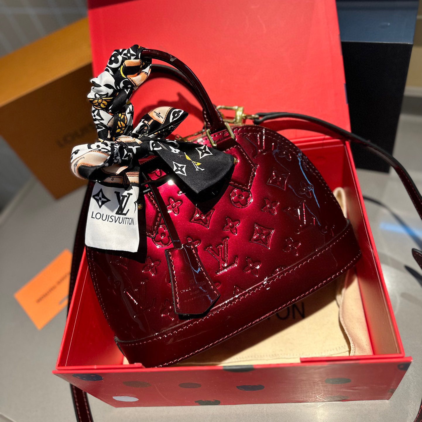 Embossed bright leather Alma shell bag 1824041702