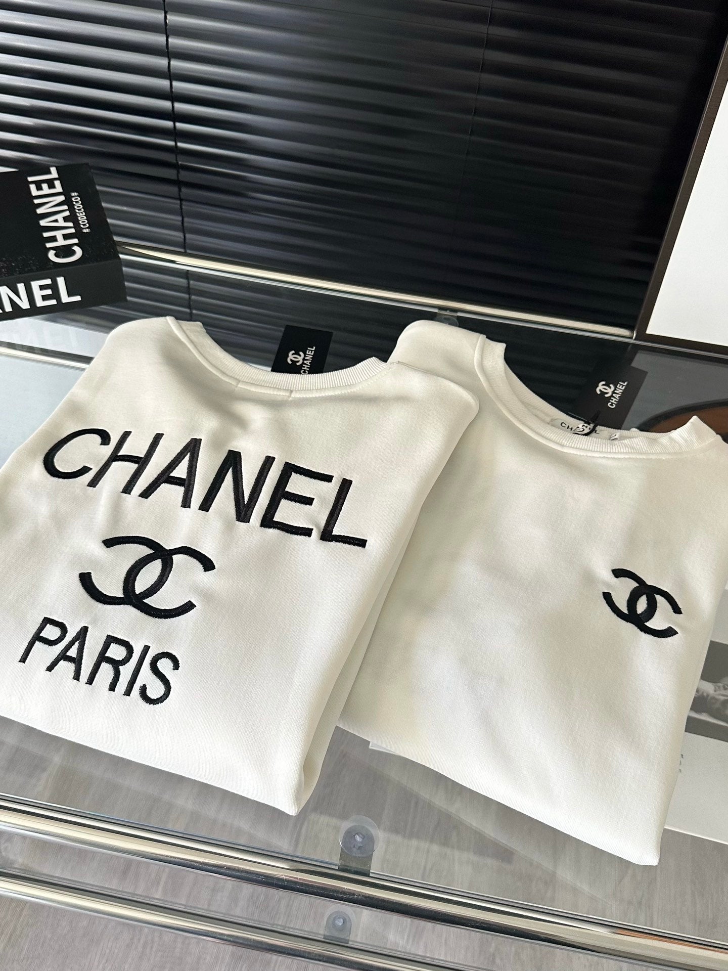 Black and white crew neck sweatshirt with front and back embroidery logo XC0823100906