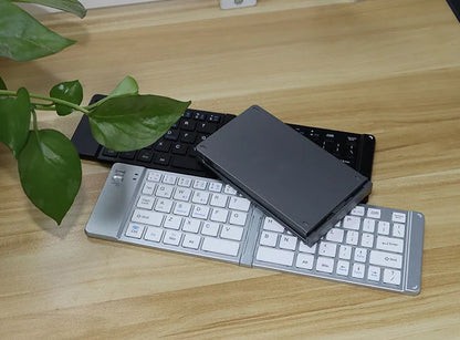 2025 new Blue tooth ultra-thin mini foldable rechargeable phone, tablet, computer keyboard