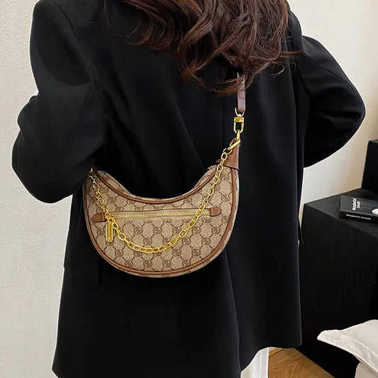 ‌Light luxury crocodile embossed crescent-shaped bag 2025073122
