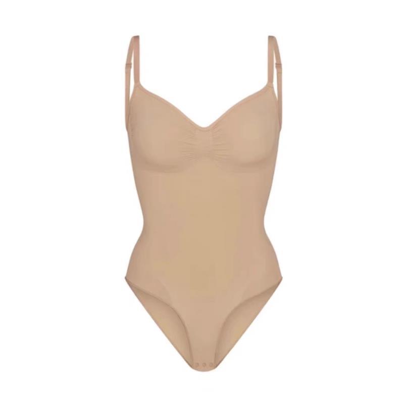 Skims Kardashian with the same sexy non-marking one-piece shapewear waist belly triangle hip thong